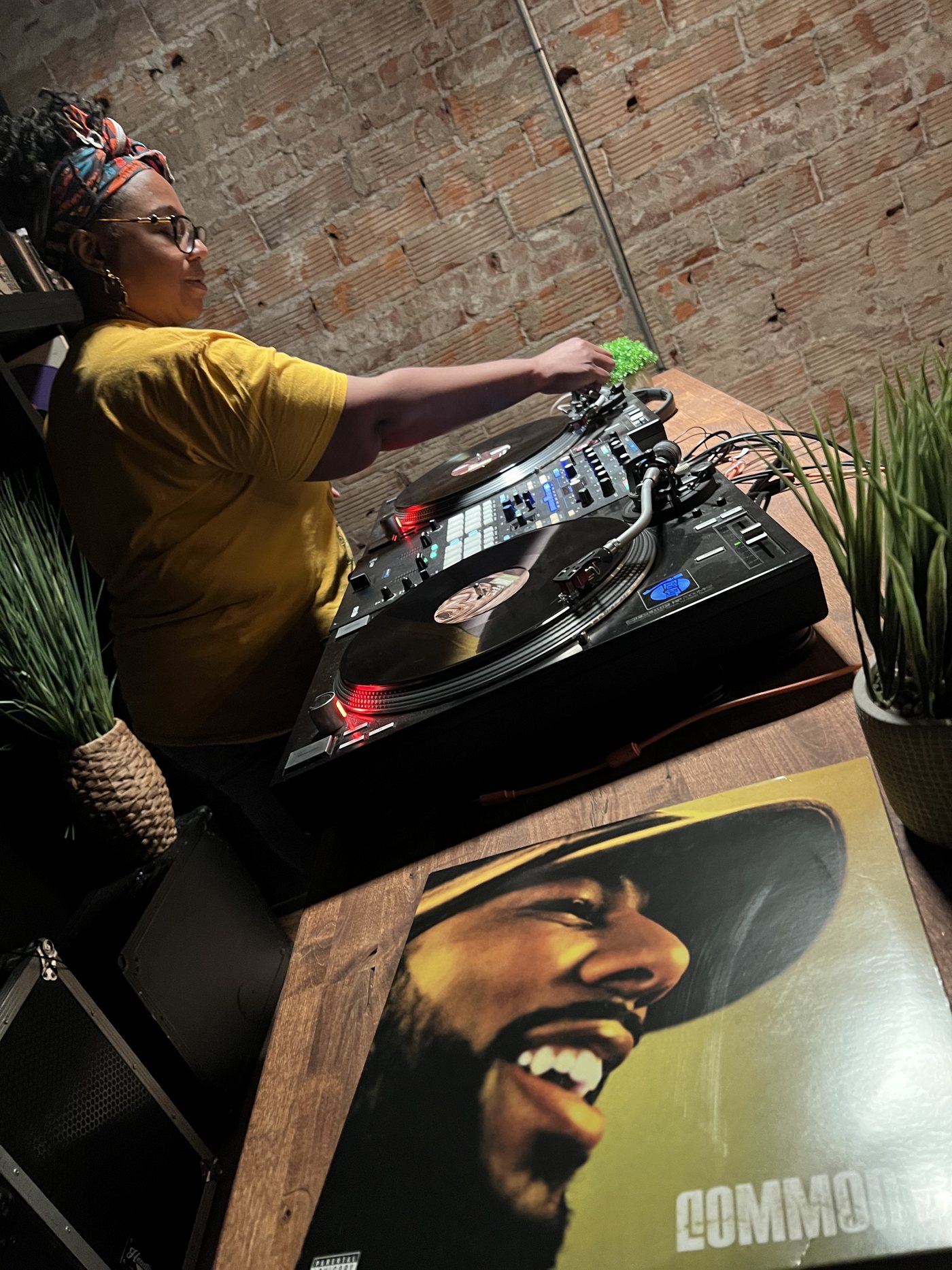 Dr. Adrienne Kennedy at the turntables in a Straight Through listening room, vinyl records at hand